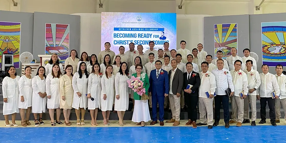 Believers gathered at the AATF Campsite and Prayer Mountain during the Bethlehem Area Fellowship, listening to a message by Leticia S. Ferriol on preparing for Christ’s second coming, with leaders and attendees from various regions worshipping together.