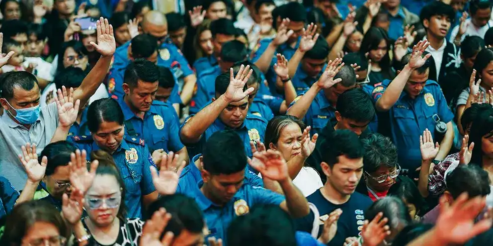 Worshippers raise their hands in prayer during the Home Free Global Crusade Caloocan 2026, responding in faith to the Gospel message and seeking God's healing, salvation, and spiritual renewal.